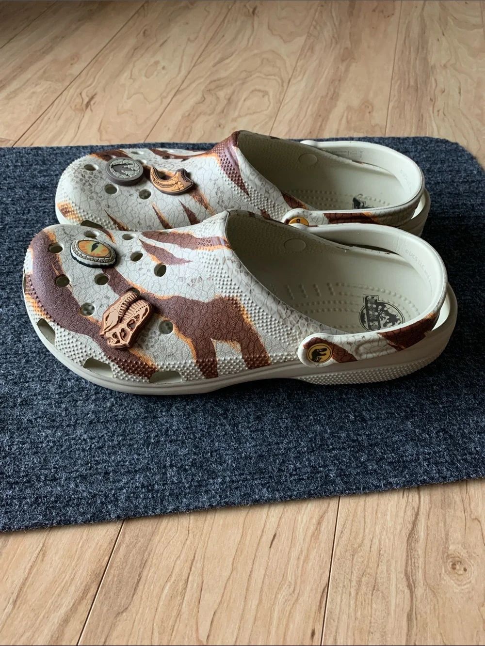 CROCS Jurassic World Clogs in Cream, Brown & Tan